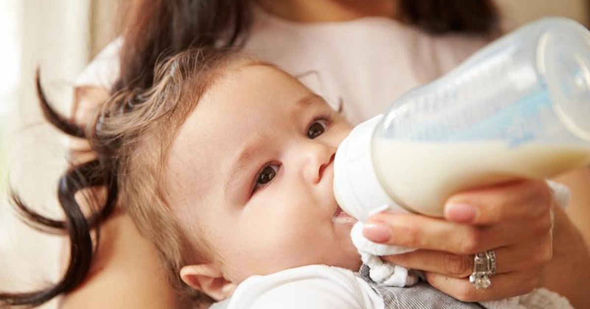 What are the pros and cons of using a baby-bottle cereal feeder?