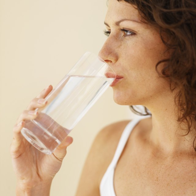 someone taking a sip of water stock image